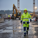 Premium Hi-Vis Yellow/Navy Blue Rain Jacket with Extended Back, Waterproof and Lightweight for Optimal Visibility in Poor Weather Conditions