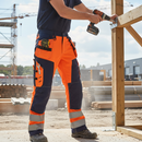 Premium High Visibility Softshell Craftsman Trousers with Holster Pockets for Durability and Comfort in Rough Weather Conditions