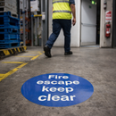 Fire Escape Floor Graphic Sign – 400mm Diameter – Polycarbonate – Industrial