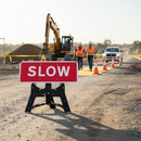 Professional Slow Traffic Sign 1050x450mm with RA1 Reflective Face and Durable Plastic Stand for Road Safety