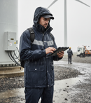 Premium Waterproof Parka with Adjustable Hood, Storm Flap, and Reflective Piping for Enhanced Visibility