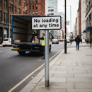 Premium No Loading at Any Time Sign - Durable Road Safety Sign with Yellow Kerb Stripes for Traffic Regulation