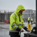 Premium Hi-Vis Yellow and Black Rain Jacket with Extended Back, Lightweight and Waterproof for Enhanced Visibility in Adverse Weather Conditions