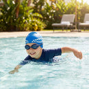 Kids swimming cap with fish design in blue and pink, made from silicone