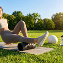 Black foam roller with EVA foam and ABS core for fitness and recovery