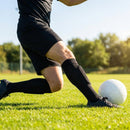 Black shin pads with compression sleeves for football players