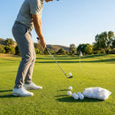 White plastic practice golf balls with air vented design