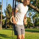 Wooden gym rings with adjustable straps for versatile fitness use