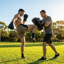 Muay Thai strike pad made of durable PVC with easy-grip handles