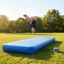 Inflatable gymnastics mat in orange and grey designed for home and gym use