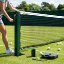 Professional tennis net and posts setup in green