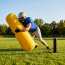 High-visibility American football training dummies in yellow PVC