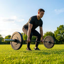 Black Olympic bumper plates made from Virgin rubber