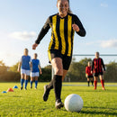 Women's football kit with long-sleeved striped shirt, shorts, and knee-high socks