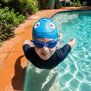 Kids swimming cap with fish design in blue and pink, made from silicone