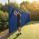 Green Tennis Court Windbreaks on an outdoor tennis court