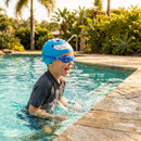 Kids swimming cap with fish design in blue and pink, made from silicone