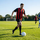 Men's striped football kit with shirt, shorts, and socks