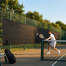 Green Tennis Court Windbreaks on an outdoor tennis court
