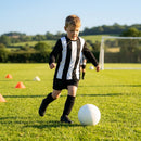 Kids' football kit with striped long sleeve shirt, shorts, and knee-high socks