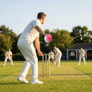 Cricket training ball with reverse swing capability, in red/white and pink/white