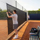 Green Tennis Court Windbreaks on an outdoor tennis court