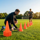 Set of vibrant football training cones in various sizes and colours