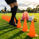 Set of vibrant football training cones in various sizes and colours
