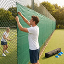 Green Tennis Court Windbreaks on an outdoor tennis court
