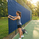 Green Tennis Court Windbreaks on an outdoor tennis court