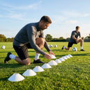 Set of vibrant football training cones in various sizes and colours