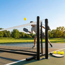 Pickleball posts with base plates in blue, black, and green for club use